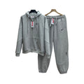 NOCTA Nike x Supreme grigia con zip e pantaloni coordinati