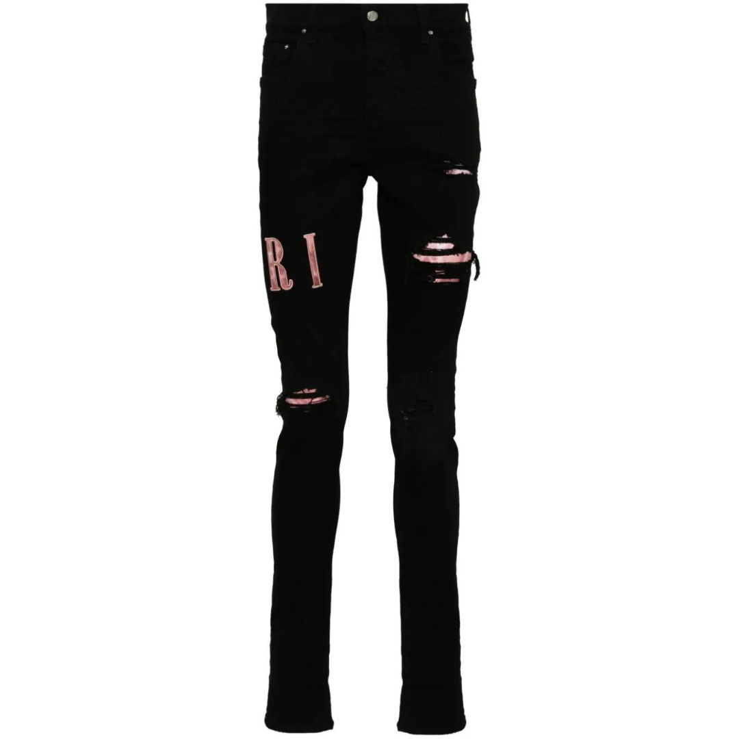 AMIRI waxed logo-appliqué skinny jeans