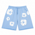 Denim Tears Pantaloncini da tuta The Cotton Wreath “Azzurro Cipria”