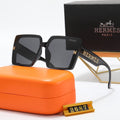 Black square sunglasses with gold-tone details